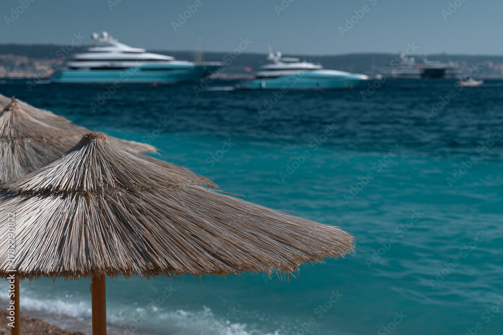 Fototapeta premium Tropical beach with umbrellas.