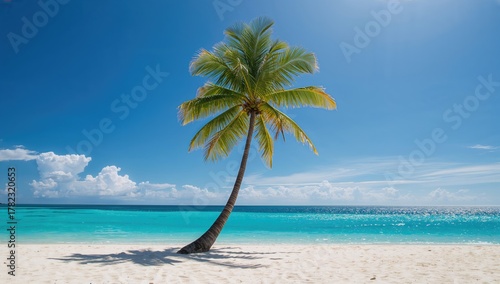 Fototapeta Naklejka Na Ścianę i Meble -  Dreamy beach featuring a palm tree on fine white sand with a turquoise ocean backdrop, perfect for summer travel