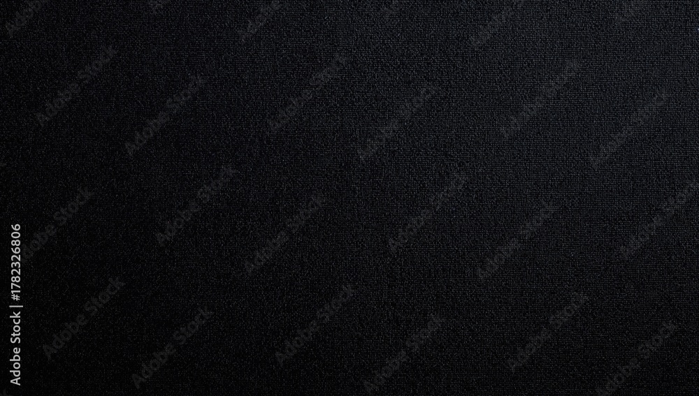 Fototapeta premium Black textile texture ideal for design projects, functional backdrop for layouts