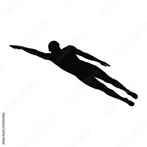 Silhouette of a male swimmer in freestyle stroke swimming
