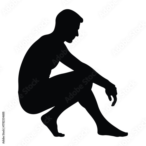 Silhouette of a man crouching and looking down male
