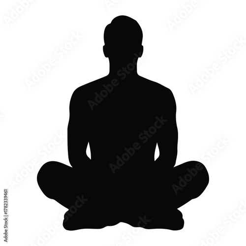 Silhouette of a man meditating in a lotus position