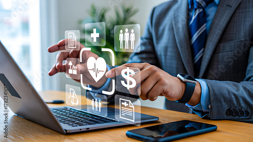 A businessman manages digital health insurance and medical plans, interacting with virtual icons for wellness, finance, and corporate employee benefits.