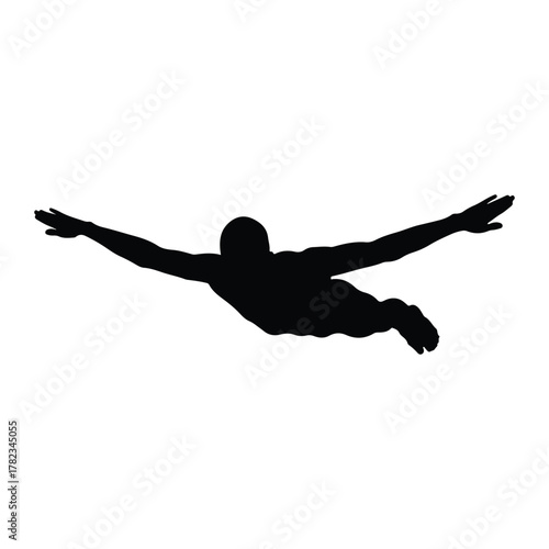 Silhouette of a man swimming with arms outstretched