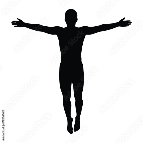 Silhouette of a man with arms outstretched in a triumphant pose