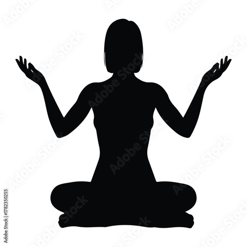 Silhouette of a person meditating in a lotus position