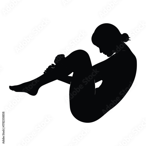 Silhouette of a woman curled up in a ball on white background