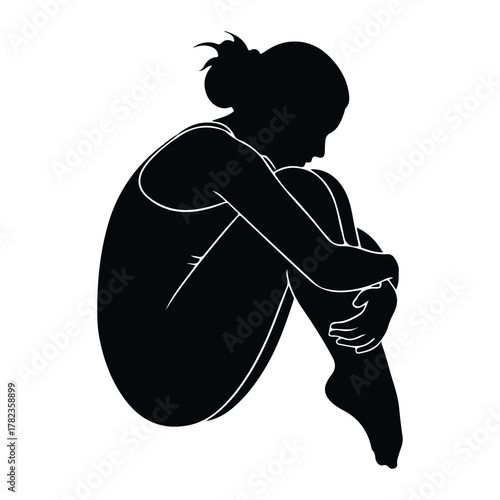 Silhouette of a woman curled up in a ball on white background