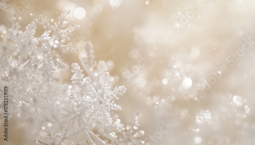A tranquil close-up of shimmering white snowflakes against a softly blurred backdrop, evoking a seasonal change
