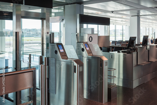 Automated airport gate at modern airport for scanning boarding pass. Concept of digitalization, self-check-in and independent travel.