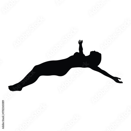 Silhouette of a woman lying back with arms outstretched