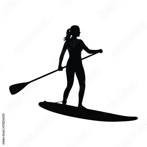 Silhouette of a woman paddleboarding Keywords: woman, silhouette, paddleboarding, stand up
