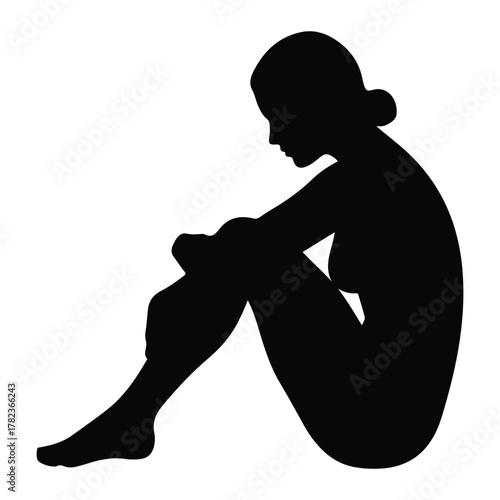 Silhouette of a Woman Sitting in a Fetal Position female
