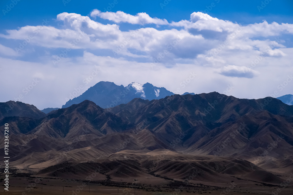 Naklejka premium The distant snow-capped mountains