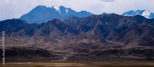 The distant snow-capped mountains