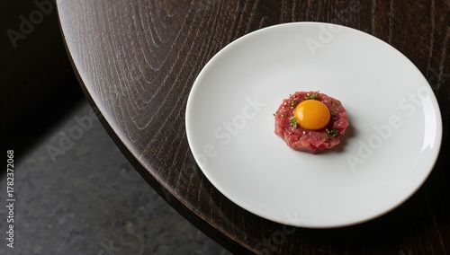 Beef tartare presented on a...