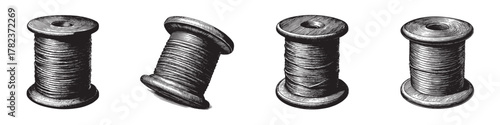 Four vintage wooden spools of thread in various positions, showcasing intricate details.