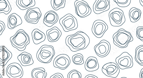 Organic, abstract shapes with concentric line patterns are scattered randomly to create a modern and minimalist seamless background design.