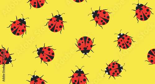 Bright red ladybugs with black spots are scattered across a vibrant yellow background, creating a cheerful and summery seamless pattern.