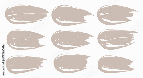 A collection of nine textured, beige paint brush strokes with glossy highlights, arranged in a grid on a white background.