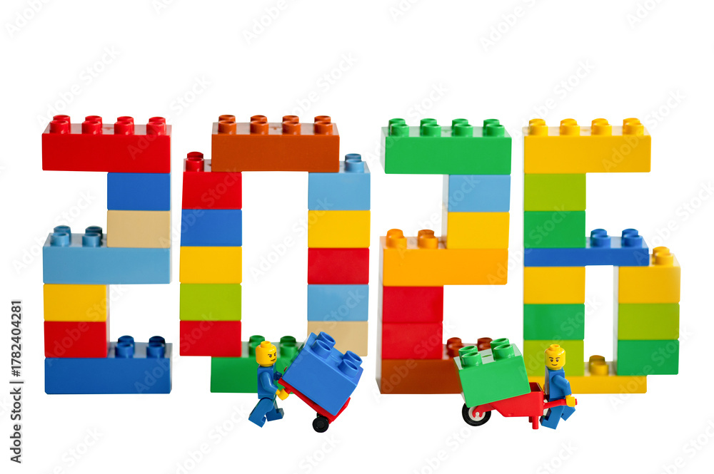Naklejka premium The numbers 2026 made from different colored Lego bricks and workers on a white background.