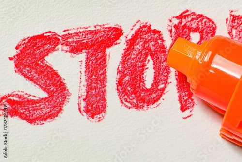 A close-up of a red marker highlighting the word 