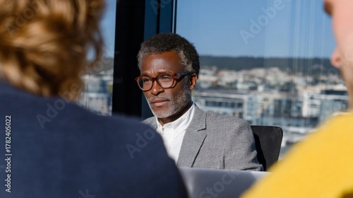 Distinguished African male executive in contemplative daylight, embodying World Thinking Day and global business insight at sky-high altitude