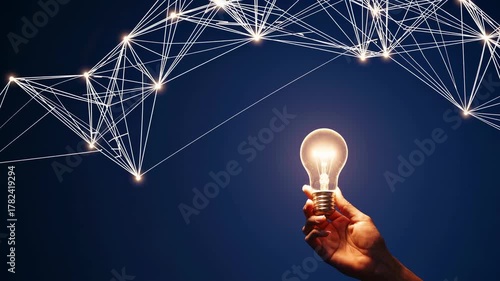 Hand raising illuminated lightbulb under futuristic network of connected points in motion