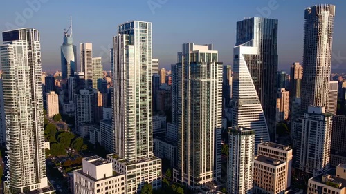 Highrise skyline panorama: drone perspective of a modern cityscape at dusk