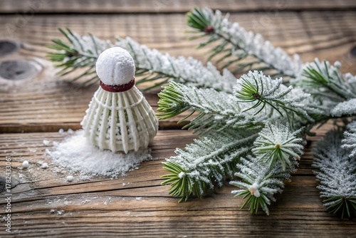 Miniature Badminton Shuttlecock Ornament Amongst Snowy Pine Branches Rustic Wooden Surface Festive Atmosphere Decoration Still Life