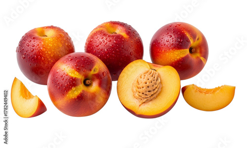 A vibrant arrangement of fresh nectarines, with one cut in half to reveal its juicy interior and pit, surrounded by whole fruits and slices.