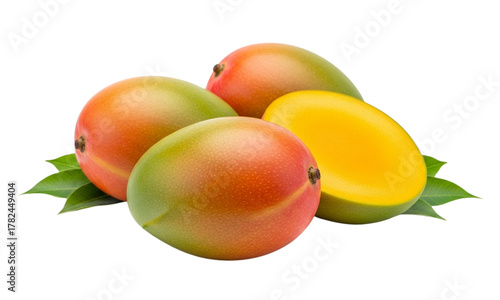 Fresh ripe mangoes with green leaves, one cut open revealing vibrant yellow flesh on a white background.