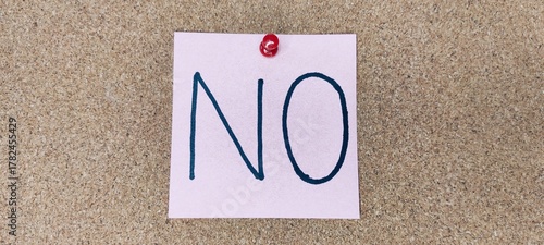 Simple Reminder Displayed on a Corkboard Indicates Refusal or Rejection of a Request Without Further Details