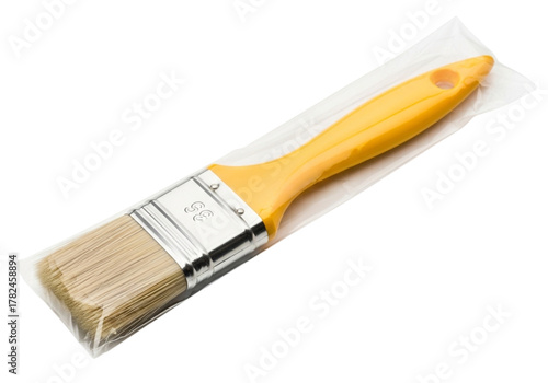 New paint brush with yellow handle, bristles covered in plastic packaging, isolated on transparent background