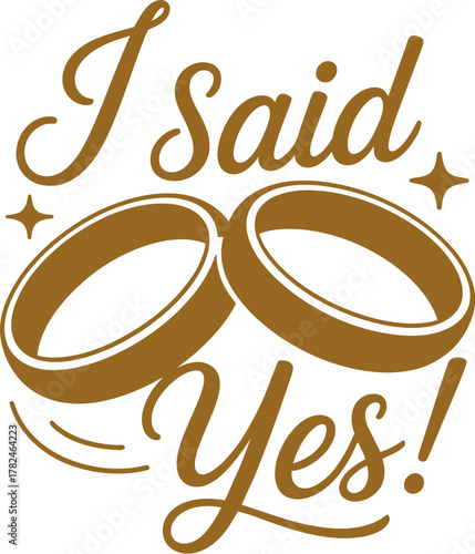 Two gold wedding rings symbolize the declaration 'I said Yes!'