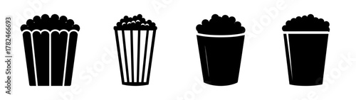 Four black silhouette icons of popcorn buckets and cups filled with popcorn