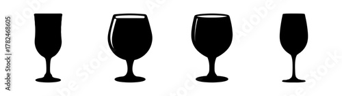 Collection of four black silhouette wine glasses and champagne flutes on a