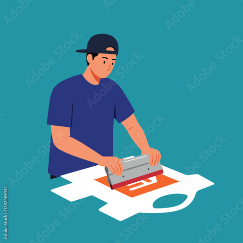 Illustration of a person screen printing a graphic onto a white t-shirt. The background is a teal color