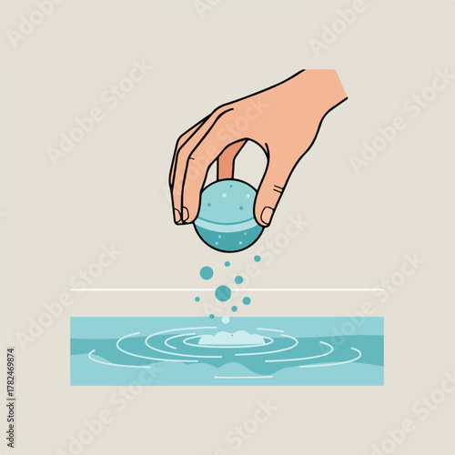 A hand holding a blue bath bomb, releasing bubbles into turquoise water, creating ripples. The backdrop is a beige hue