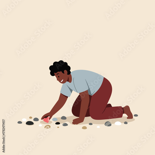 An illustration shows a person on their knees, picking up a heart-shaped object from among pebbles