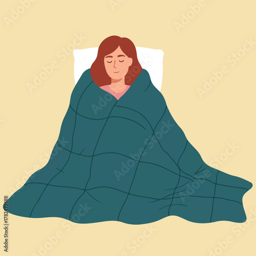 A woman with closed eyes is lying down in bed, wrapped in a blue blanket, over a white pillow