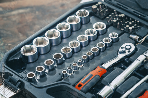 Set of socket wrenches in black case. Tool set includes socket wrench, ratchet and sockets. Repair.