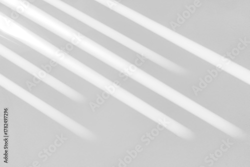 Gray shadow and light blur abstract background on white wall  from window. Dark stripe grey shadows indoor in room  background, monochrome, shadow overlay effect for backdrop and mockup design