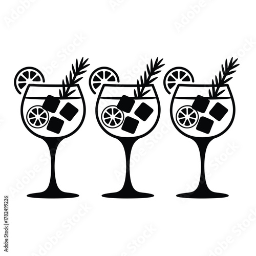 Three refreshing gin and tonic cocktails with ice and lemon slices
