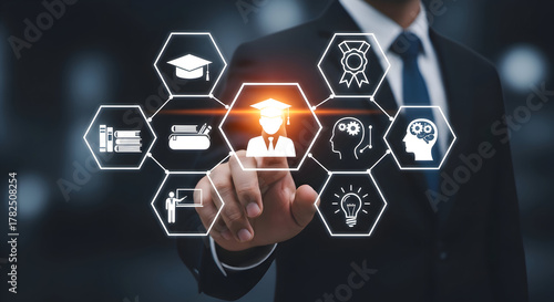 Professional businessman interacts with glowing digital education icons, symbolizing learning, knowledge, and achievement in a modern business context.