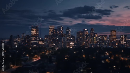 Wallpaper Mural Aerial view of a sprawling urban cityscape with countless illuminated buildings and towering skyscrapers at tranquil dusk Torontodigital.ca