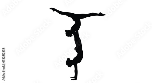 Acrobatic duo performs a handstand on, showcasing strength, balance, and teamwork in a stunning silhouette
