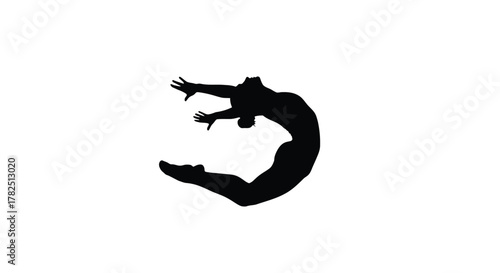 Silhouette of a graceful gymnast performing a jump