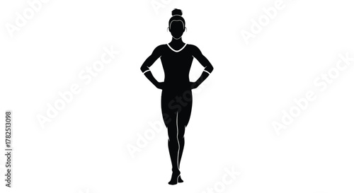 Silhouette of a female gymnast standing with hands on hips, showcasing strength and balance