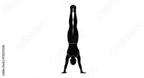 Silhouette of a gymnast performing a handstand, showcasing strength, balance and control